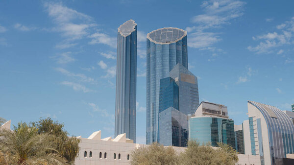 Beautiful view of the skyscrapers of Abu Dhabi over blue sky. sunny summer day