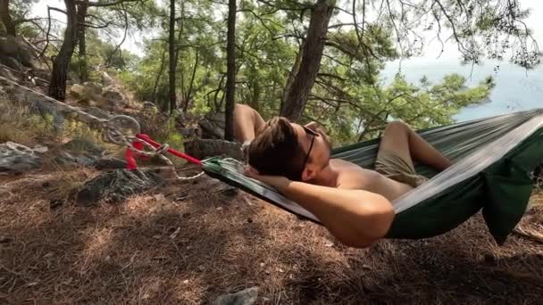 Back View Man Silhouette Relaxing Orange Hammock Two Trees Pine — Stock Video