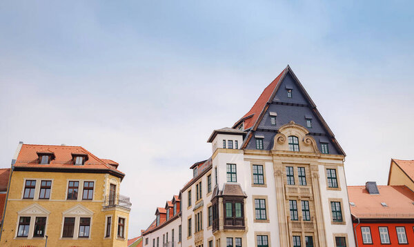 Spring trip to Europe. Travel and German sightseeing locations. scenic view to facade of old historic houses somewhere in Erfurt city, Traditional half-timbered houses makes cozy and fairy tail mood