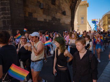 Prague, Czech Republic - August 12, 2023: Pride month in old city center. Prague Pride Festival Parade. festival participants in different costumes, the beginning of the procession clipart