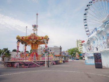 Vienna, Austria, July 19, 2023. The Wurstelprater amusement park or Vienna Prater in sunny morning. Mix of nature, leisure, and vibrant urban atmosphere in every corner. clipart