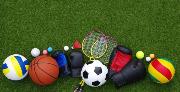 stock image Set of sport equipment on green grass