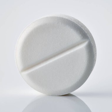 white pill macro on white background