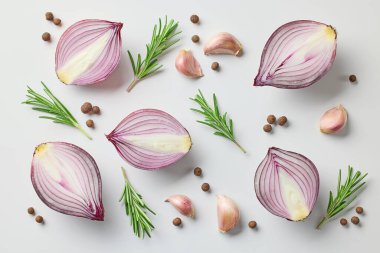 composition of red onions and spices on white background, top view