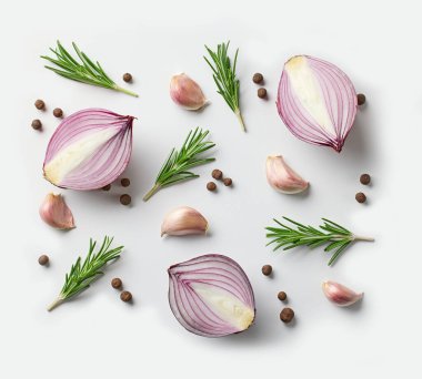 composition of red onion and spices on white background, top view