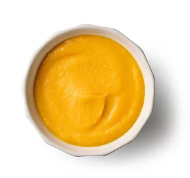 bowl ov vegetable cream soup isolated on white background, top view