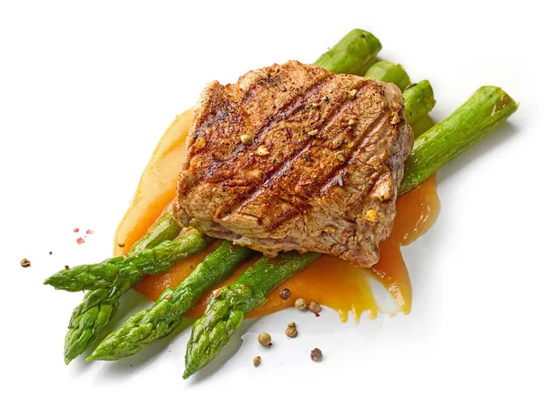 Grilled Pork Steak Steamed Asparagus Isolated White Background Top View — Zdjęcie stockowe