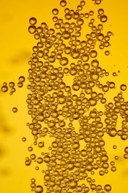 Close up background texture of lager beer with bubbles