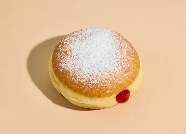 Freshly Baked Jelly Donut Beige Color Background — Stock Photo, Image