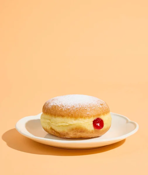 Freshly Baked Jelly Donut White Plate Isolated Orange Background — Stock Photo, Image