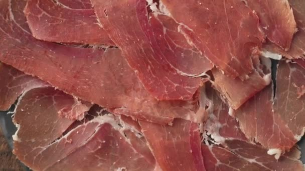 Plate Sliced Spanish Iberico Ham Wooden Table Background Rotating — Stock Video