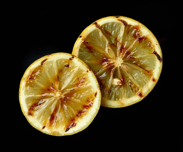 Gegrillte Saftige Zitronenscheiben Isoliert Auf Schwarzem Hintergrund Draufsicht — Stockfoto