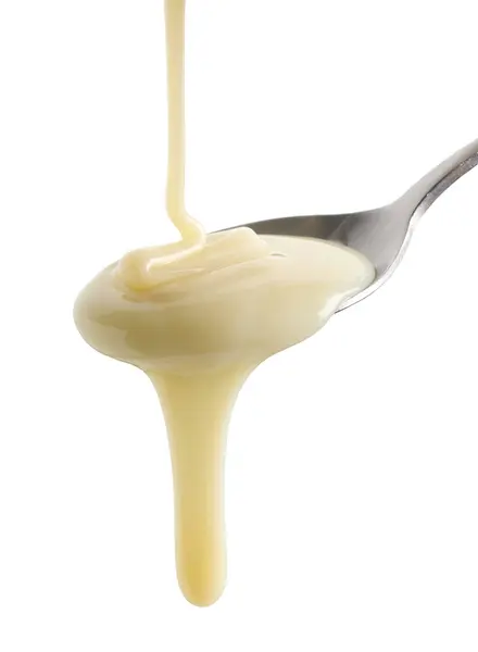 Condensed Milk Pouring Spoon Isolated White Background — Stock Photo, Image