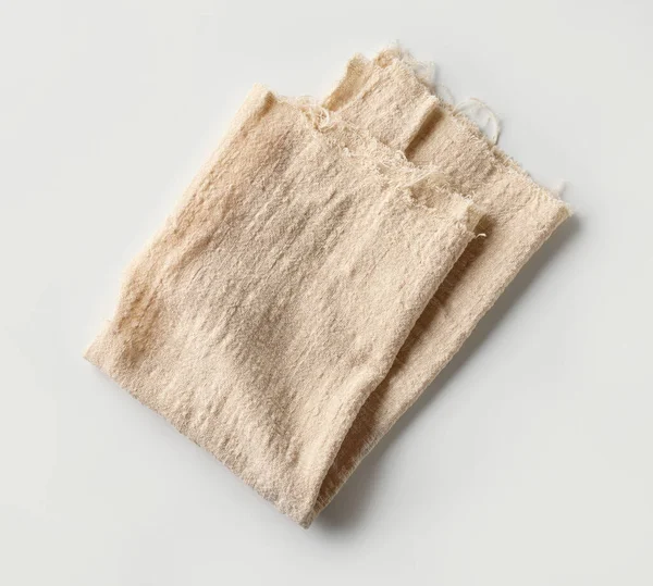 Folded Cotton Napkin Isolated Lioght Background Top View — Stock Photo, Image