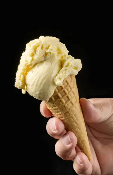 Close Vanilla Ice Cream Waffle Cone Human Hand Isolated Black — Stock Photo, Image