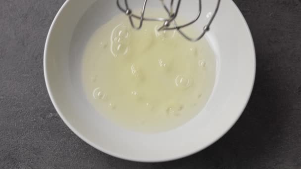 Chef Whips Raw Egg Whites White Bowl Mixer Top View — Stock Video