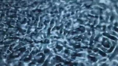 Mavi girdap halindeki su yüzeyi ses titreşimleri tarafından yaratıldı.