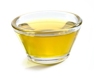 small glass bowl of olive oil isolated on white background