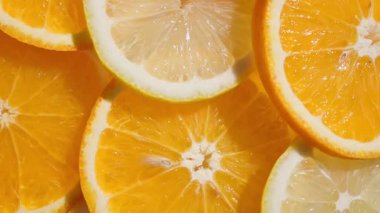 Parlak taze portakal ve limon dilimleri arka plan, üst görünüm