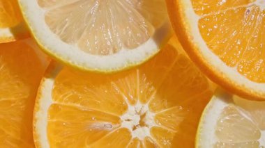 Parlak taze portakal ve limon dilimleri arka plan, üst görünüm