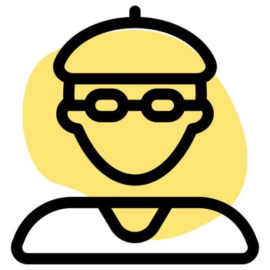 Şapka ve gözlük takan genç bir çocuk.