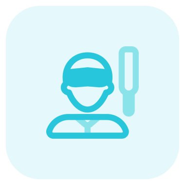 Güneşliği ve kriket sopası olan bir erkek kriket oyuncusu.