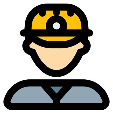 Başında lamba olan kasklı bir erkek madenci.