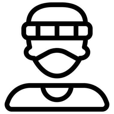 Yüz maskesi ve şapka takan genç bir delikanlı.