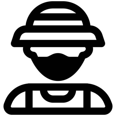 Kova şapkalı balıkçı maske takıyor.