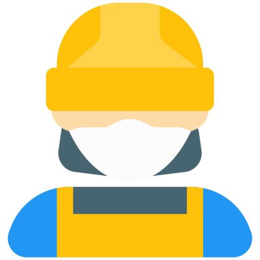 Önlem olarak maske ve miğfer takan kadın inşaatçı.