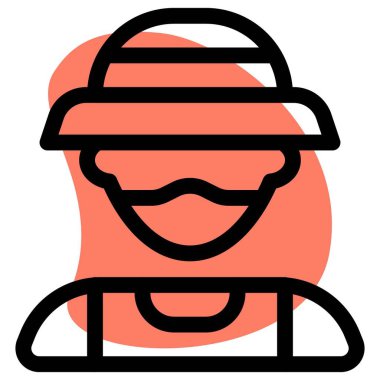 Kova şapkalı balıkçı maske takıyor.