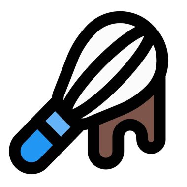 Melted chocolate dripping off from whisk