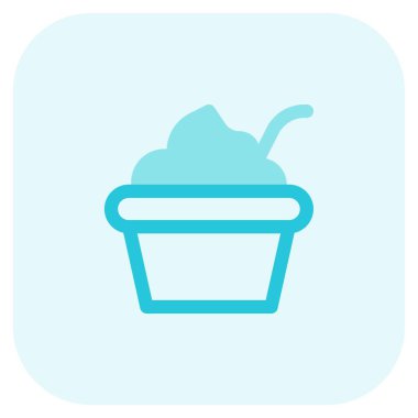 Delicious creamy yogurt bowl served with spoon.