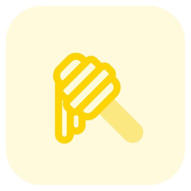 Delicious fresh honey dripping from spoon.