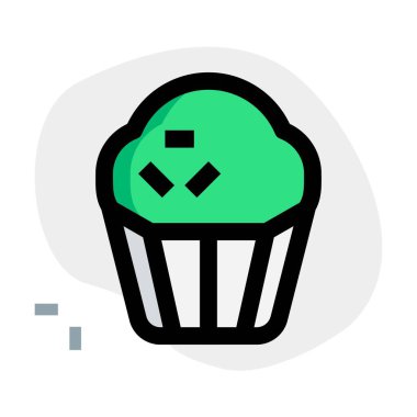 Baked muffin garnished with flavored sprinkles