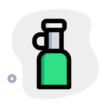 Handheld bottle of extra virgin olive oil.