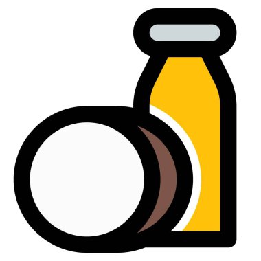 Bottle of coconut oil with coconut shell.