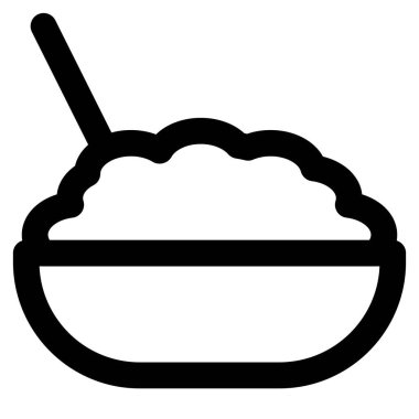 Cooked brown rice in bowl with spoon.