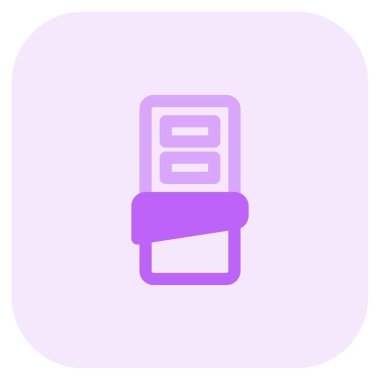 A bar of dark chocolate in wrapper.