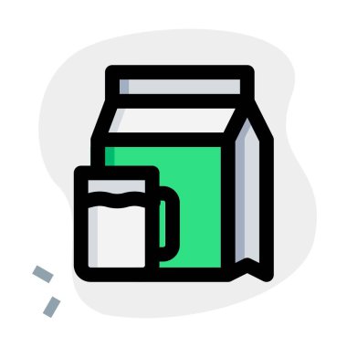 Fatty milk in package with handled mug.