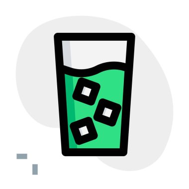 Ice cubes in a glass of cold milk