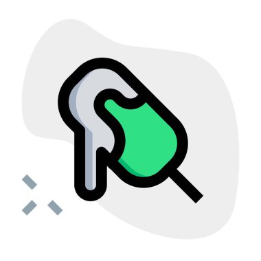 Melting cocoa ice bar on a stick.