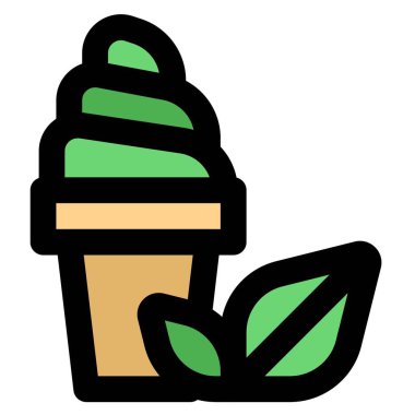 Yummy ice cream served with green tea leaves.