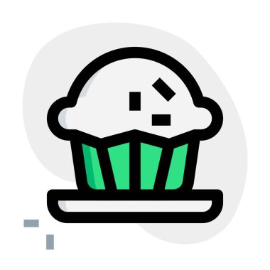 Freshly baked muffin topped with sprinkles.