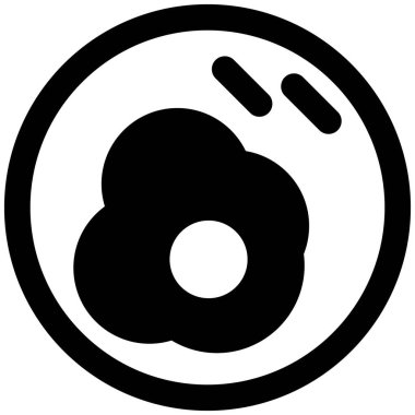 Closeup of fried egg sprinkled with pepper.