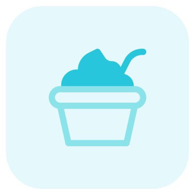 Delicious creamy yogurt bowl served with spoon.