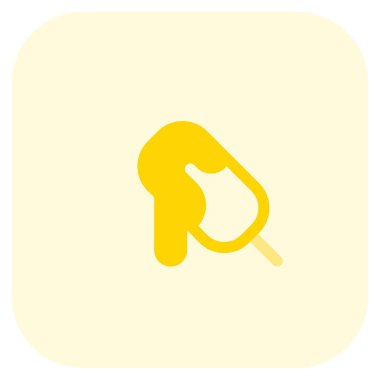 Melting cocoa ice bar on a stick.