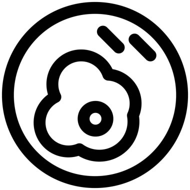 Closeup of fried egg sprinkled with pepper.