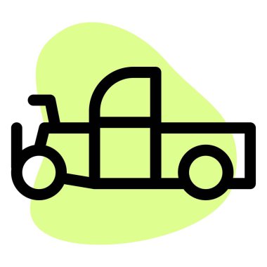 Kapalı kulübesi olan eski moda bir kamyonet.