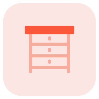 Komodin olarak kullanılan birden fazla çekmece dolabı.